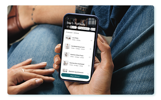 Woman checking her training via EGYM App.
